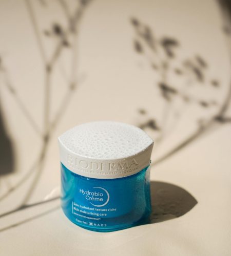 Hydrabio Creme jar with artistic shadows in a soft light setting.