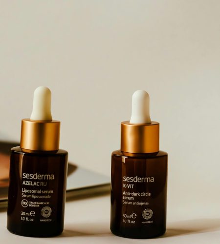 Liposomal and anti-dark circle serums showcased in stylish amber bottles with droppers.
