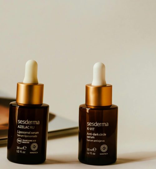 Liposomal and anti-dark circle serums showcased in stylish amber bottles with droppers.